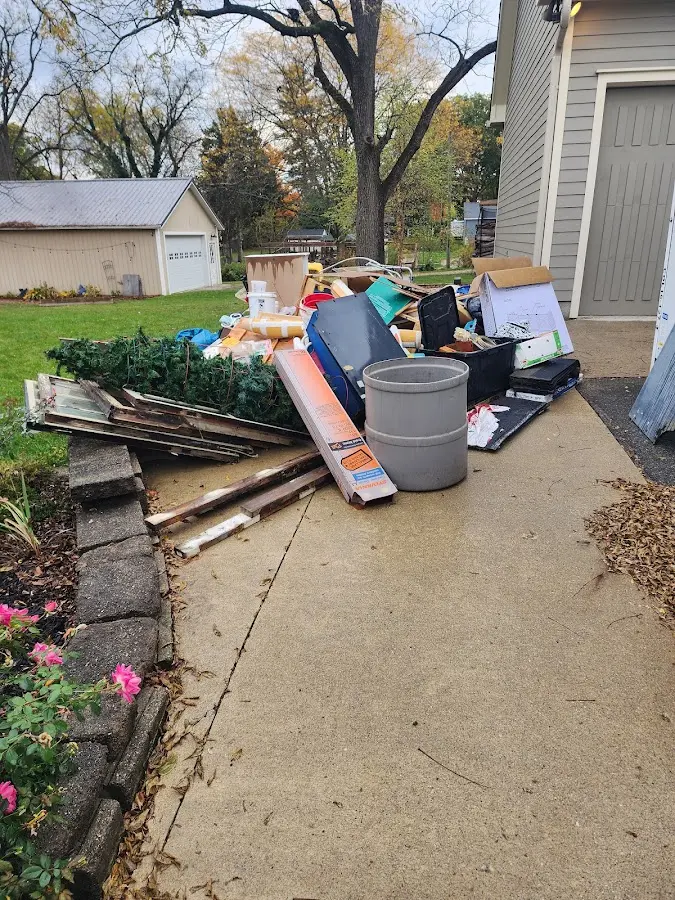 Dumpster being loaded with debris for Residential Dumpster Rental in Barnegat